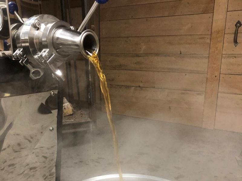 traditional maple syrup drawing off in sugarhouse